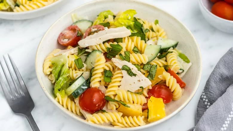 Chicken pasta salad in a white bowl