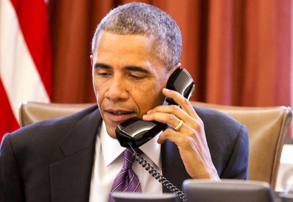 President Barack Obama speaks during a phone call on the topic of Ebola on Oct. 8, 2014. (Jacquelyn Martin/AP)