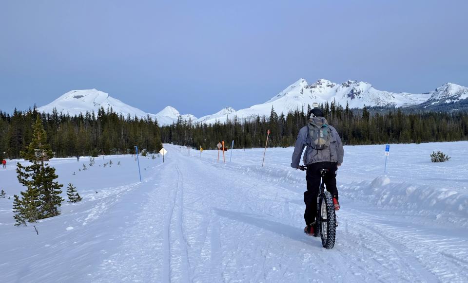 Zach Urness fat bikes through the snow just out of Dutchman Flat Sno-Park west of Bend.