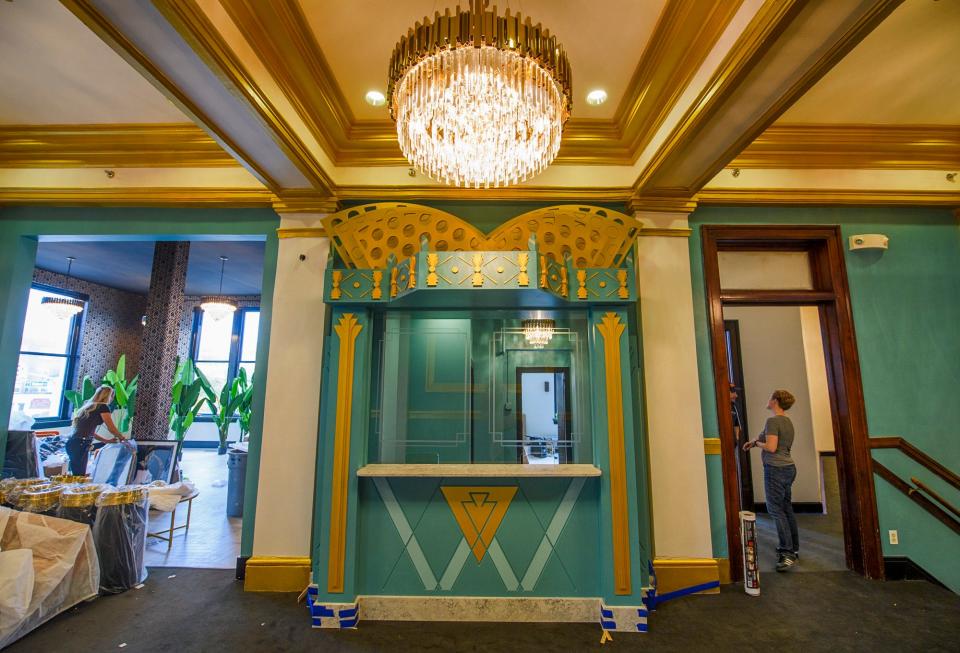 Ally Powell, a designer from Third Eye Design, left, and Constellation Stage & Screen Artistic Director Kate Galvin ready the Waldron Arts Center on Wednesday, Oct. 12, 2022, for reopening after being remodeled this year. The newly remodeled box office can be seen between them.