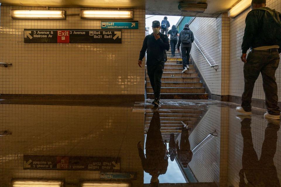 PHOTO: FILE - Commuters walk into a flooded 3rd Avenue / 149th st subway station and disrupted service due to extremely heavy rainfall from the remnants of Hurricane Ida, Sept. 2, 2021, in the Bronx borough of New York City. (David Dee Delgado/Getty Images, FILE)