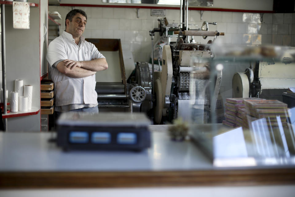 Alejandro Nigro stands at his pasta shop in Buenos Aires, Argentina, Tuesday, Aug. 13, 2019. Flour prices, the mainstay of Nigro’s business, are expected to rise following the peso devaluation on Monday. (AP Photo/Natacha Pisarenko)