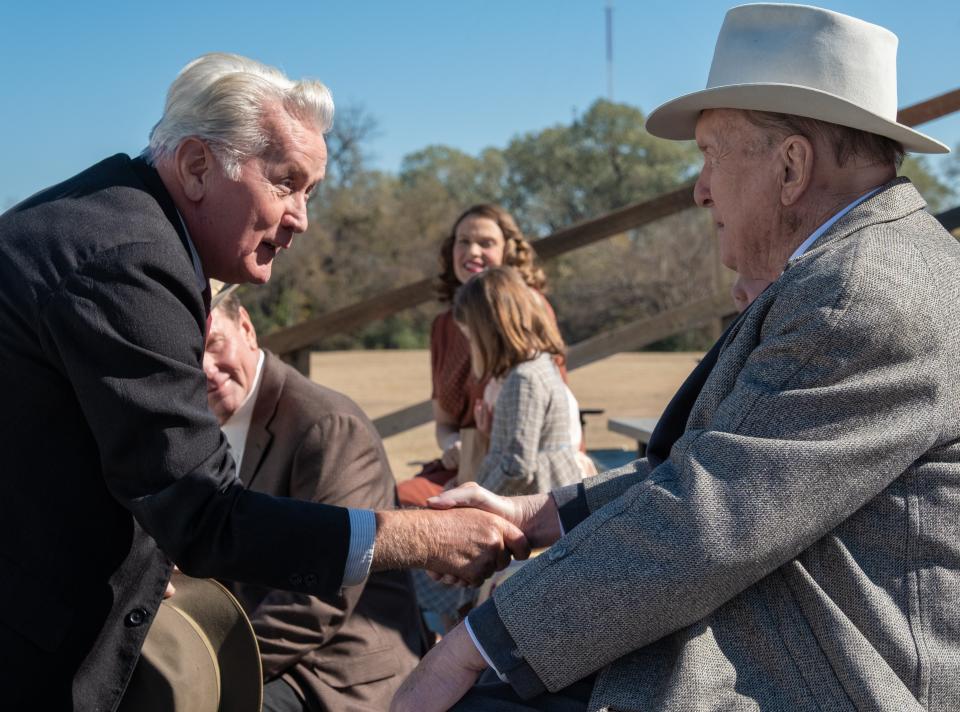 Assistant coach Doc Hall (Martin Sheen, left) greets Mason Hawk (Robert Duvall) in football drama "12 Mighty Orphans."