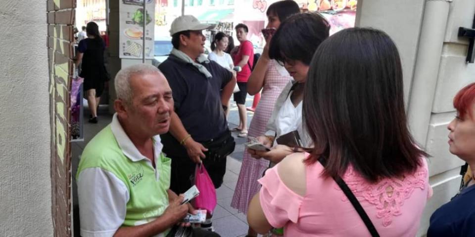 The elderly blind ticket seller can be found around Gunung Rapat, Pasir Pinji, Ipoh Jaya, Jalan Permaisuri Bainun, the Old Town areas and Concubine Lane in Ipoh. ― Picture courtesy of Big Sweep