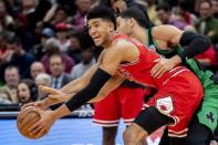 Dec 8, 2018; Chicago, IL, USA; Boston Celtics forward Jayson Tatum (0) reaches in for the ball against Chicago Bulls forward Chandler Hutchison (15) during the second half at United Center. Patrick Gorski-USA TODAY Sports