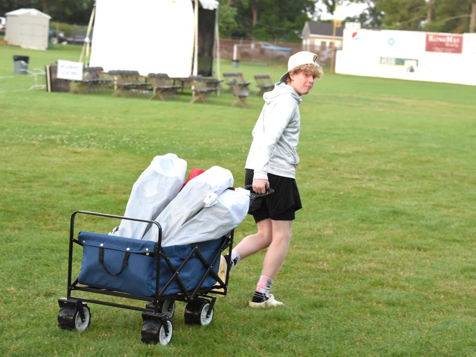 Andrew Shaner, 14, was the first one through the gates Tuesday morning with a wagon full of chairs for Tuesday night's Happy Birthday America concert and fireworks display.