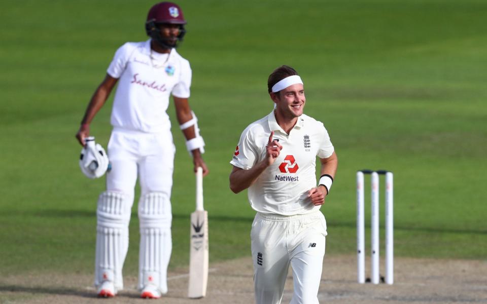 England's Stuart Broad celebrates taking the wicket of West Indies' Kemar Roach  - AFP