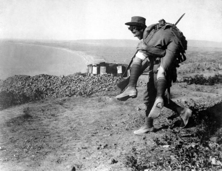 <span class="caption">An Australian soldier carries a wounded comrade in the 1915 Dardanelles campaign.</span> <span class="attribution"><span class="source">Everett Historical/www.shutterstock.com</span></span>