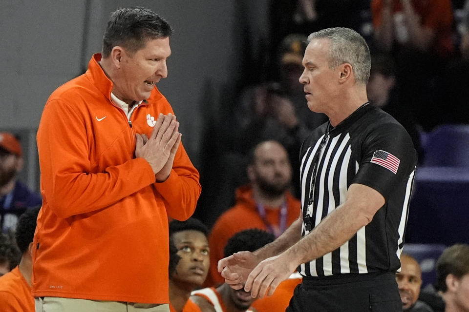 Clemson head coach Brad Brownell speaks with an official during the first half of an NCAA college basketball game against North Carolina , Saturday, Jan. 6, 2024, in Clemson, S.C. AP Photo/Mike Stewart)