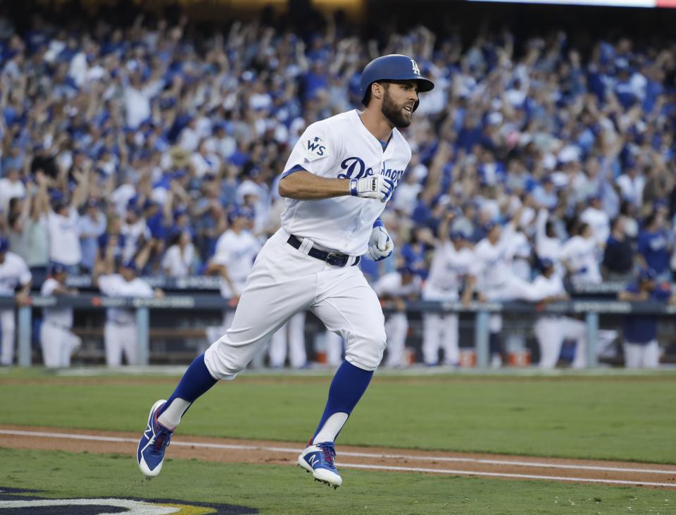 Los Angeles Dodgers’ Chris Taylor hits a home run during the first inning of Game 1 of baseball’s World Series against the Houston Astros Tuesday, Oct. 24, 2017, in Los Angeles. (AP Photo/David J. Phillip)