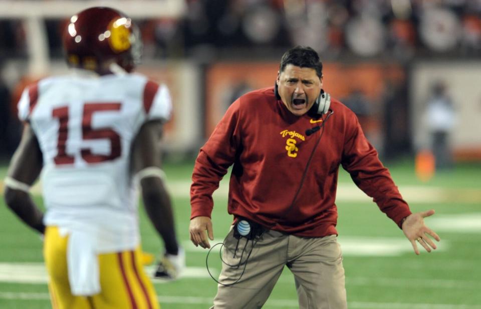 USC coach Ed Orgeron celebrates with wide receiver Nelson Agholor in 2013.