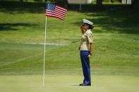 Pfc. Esmeralda Calderon stands and salutes the flag on the 15th green during the first round of the LPGA golf tournament at Kingsmill Resort and Golf Course in Williamsburg, Va., Thursday May 23, 2019. Pfc. Calderon, from San Antonio, Texas, is a Marine assigned to Naval Weapons Station Yorktown. (John Sudbrink/The Daily Press via AP)