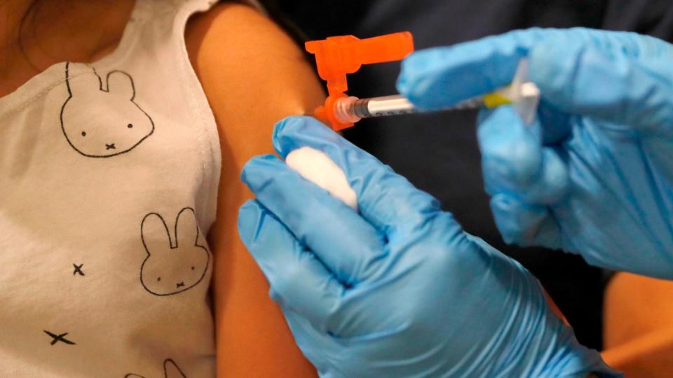 PHOTO: Emerson Ngim, of San Jose, gets her Covid-19 vaccination from licensed vocational nurse  Sharon Villegas at the Santa Clara County Fairgrounds in San Jose, June 21, 2022.  (Jane Tyska/The Mercury News/Getty Images, FILE)