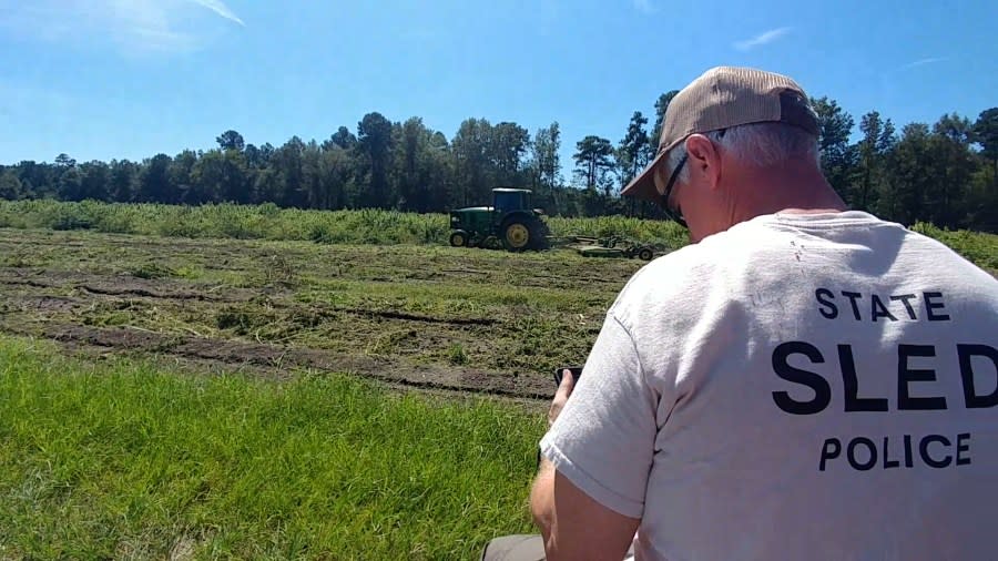 SC Law Enforcement Division Major Frank O’Neal is photographed riding on the back of a pickup truck during a Sept. 19, 2019 raid of a hemp farm in Dorchester County, SC. O’Neal heads SLED’s narcotics unit, according to the agency’s website. (Source: Pendarvis v. Keel, et. al.)