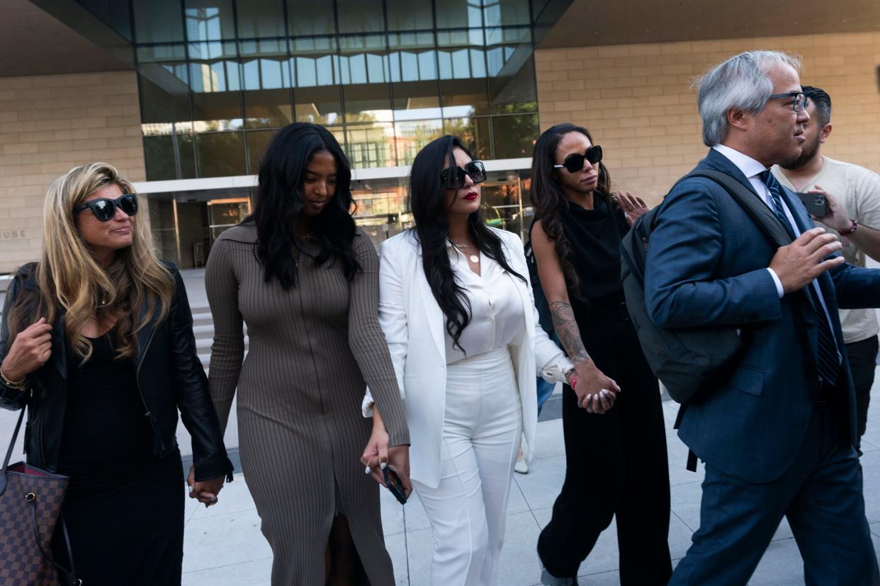 Vanessa Bryant, center, leaves a federal courthouse with her daughter, Natalia, center left, and soccer player Sydney Leroux, center right.