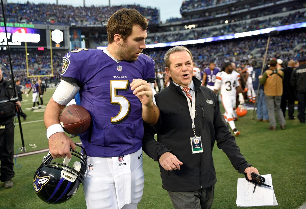 Ravens quarterback Joe Flacco speaks with Kevin Byrne, the team's senior vice president for public and community relations, after a game vs. the Browns, Sunday, Dec. 28, 2014, in Baltimore.