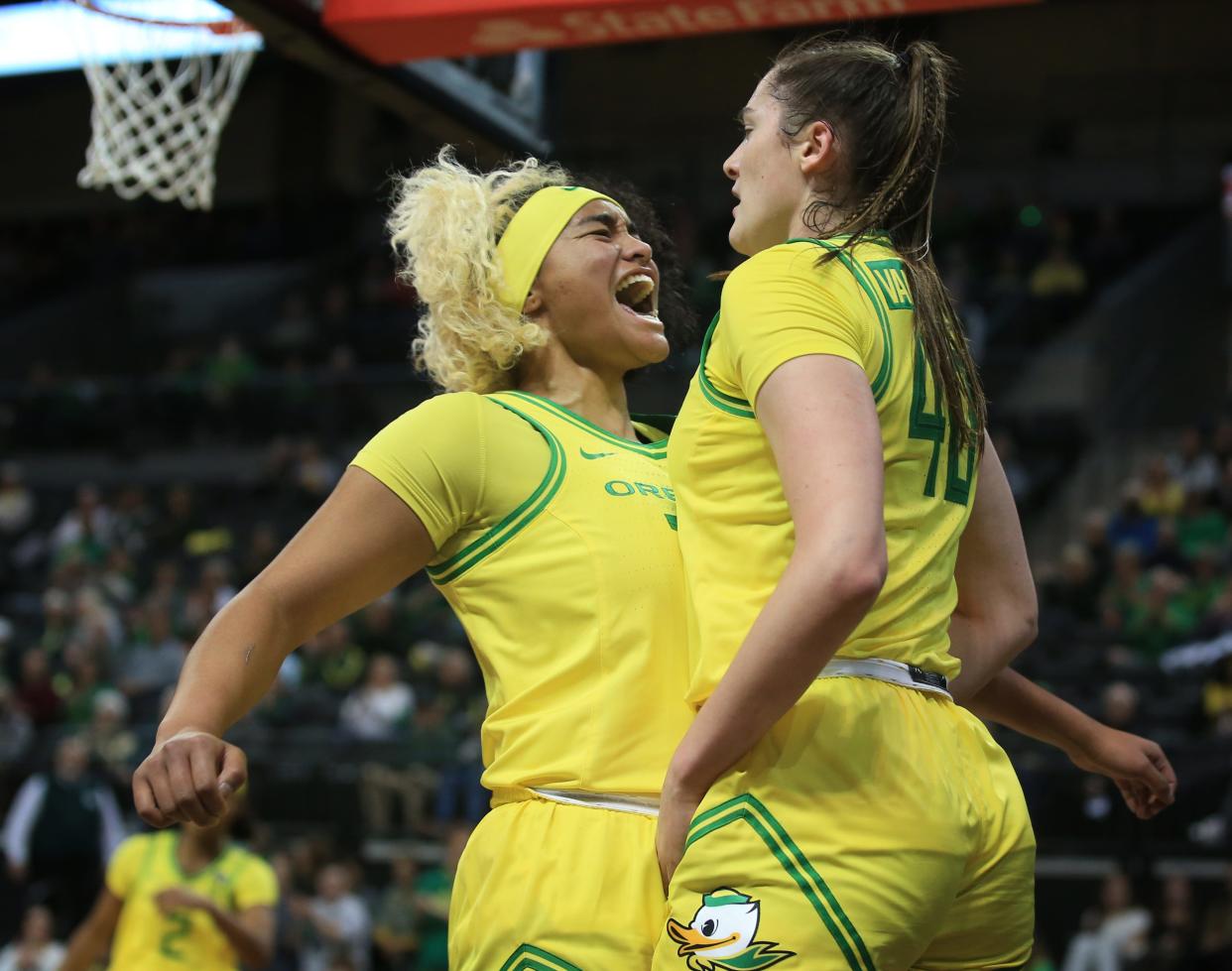 Oregon's Te-Hina Paopao, left, and Grace VanSlooten celebrate a play against Southern Utah Nov. 21.