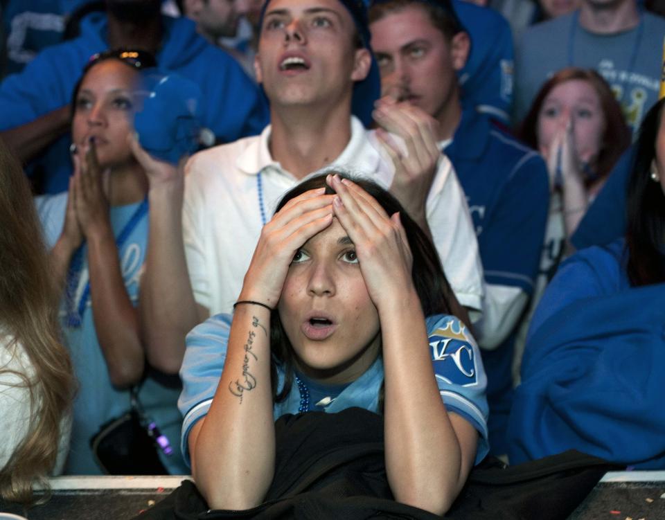 Kansas City Royals fans react to their team's loss at baseball's World Series against the San Francisco Giants, during a watch party at The Kansas City Power & Light District in Kansas City, Missouri, October 29, 2014. REUTERS/Sait Serkan Gurbuz (UNITED STATES - Tags: SPORT BASEBALL)