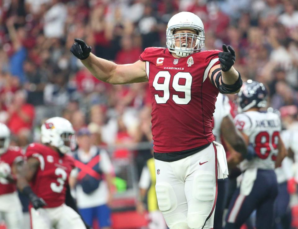 Arizona Cardinals defensive end J.J. Watt (99) celebrates after a tackle against the Houston Texans during the second quarter in Glendale, Ariz. Oct. 24, 2021.