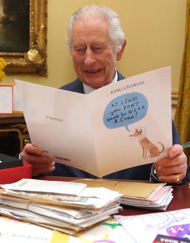 <p>WPA-Rota/Press Association Images</p> King Charles III reads cards and messages, sent by wellwishers following his cancer diagnosis, in the 18th Century Room of the Belgian Suite in Buckingham Palace