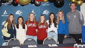 Six local girls that played on the first-ever NEOFC Bartlesville Club Team — coached by Jamie Peterson, right. The girls, from left, are Eva Sigler, Sawyer Kirkland, Millie Butler, Jessica Carithers, Jaci Decker and Lauren Shoesmith. Butler, Carithers and Decker recently signed college letters of intent.