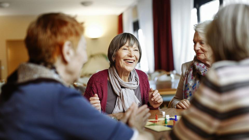 senior women playing board game