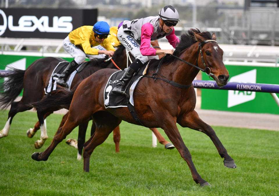 Jockey Jordan Childs rides Surprise Baby to victory in the Lexus Bart Cummings at Flemington Racecourse in Melbourne on October 5, 2019. 