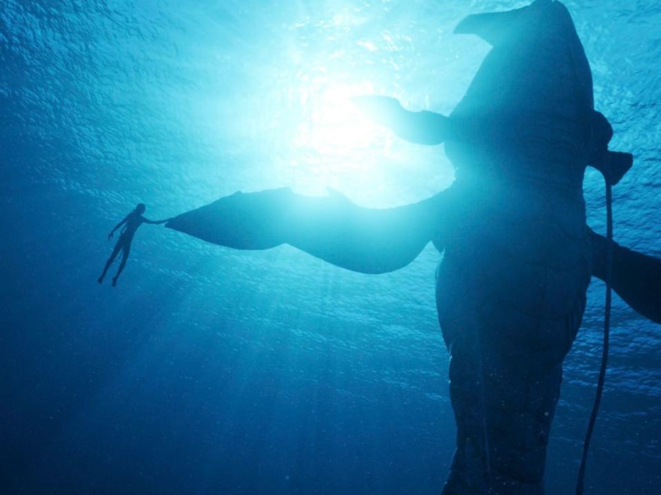 Tulkun ’bout a revolution: Lo’ak (Britain Dalton) connects with the whale-like undersea creature in ‘The Way of Water' (20th Century Films)