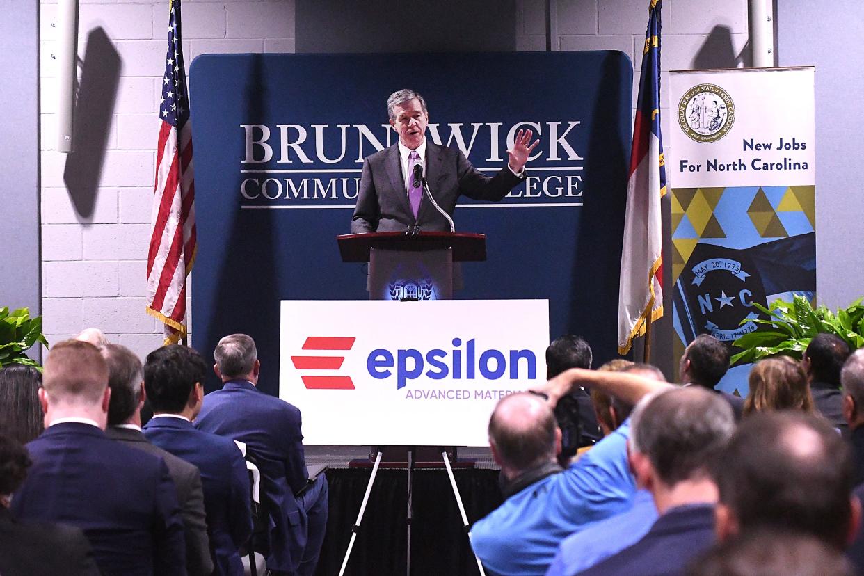 Gov. Roy Cooper speaks as officials with Epsilon Advanced Materials and Brunswick County announce the company plans to build an electric vehicle battery plant in the county during a news conference Thursday at Brunswick Community College's Odell Williamson Auditorium Thursday Oct. 26, 2023 in Bolivia, N.C. KEN BLEVINS/STARNEWS