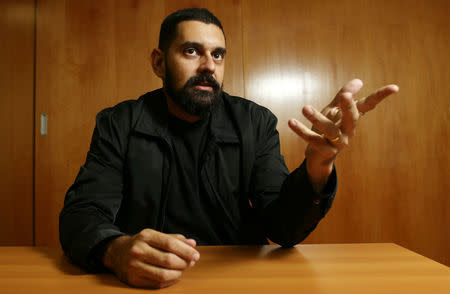 Brazilian health inspector and whistleblower of the investigation, dubbed "Operation Weak Flesh," Daniel Gouveia Teixeira, gestures as he poses for a picture in Brasilia, Brazil, March 22, 2017. Picture taken March 22, 2017. REUTERS/Adriano Machado