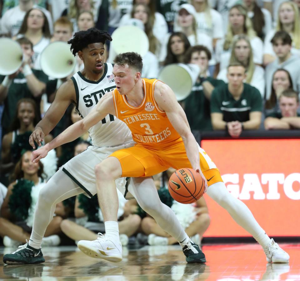 Michigan State Spartans guard A.J. Hoggard (11) defends against Tennessee Volunteers guard Dalton Knecht (3) during first-half action at Breslin Center in East Lansing on Sunday, Oct. 29, 2023.