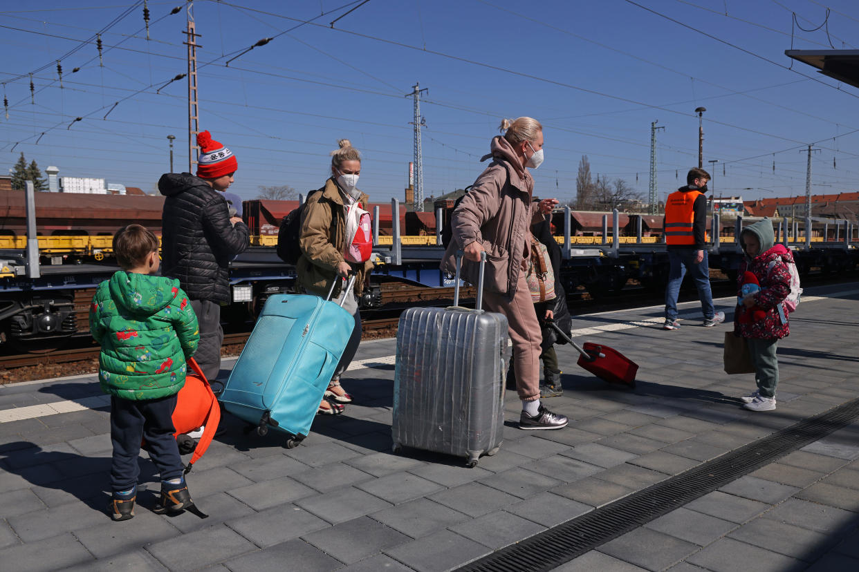 COTTBUS, GERMANY - MARCH 23: Women and children from war-torn Ukraine arrive on a chartered train from Przemysl, Poland, on March 23, 2022 in Cottbus, Germany. As of today Cottbus is serving as Germany's third railway transit hub after Berlin and Hanover for distributing arriving Ukrainian refugees across the country. Over 200,000 Ukrainians have arrived in Germany since the Russian invasion on February 24.  (Photo by Sean Gallup/Getty Images)