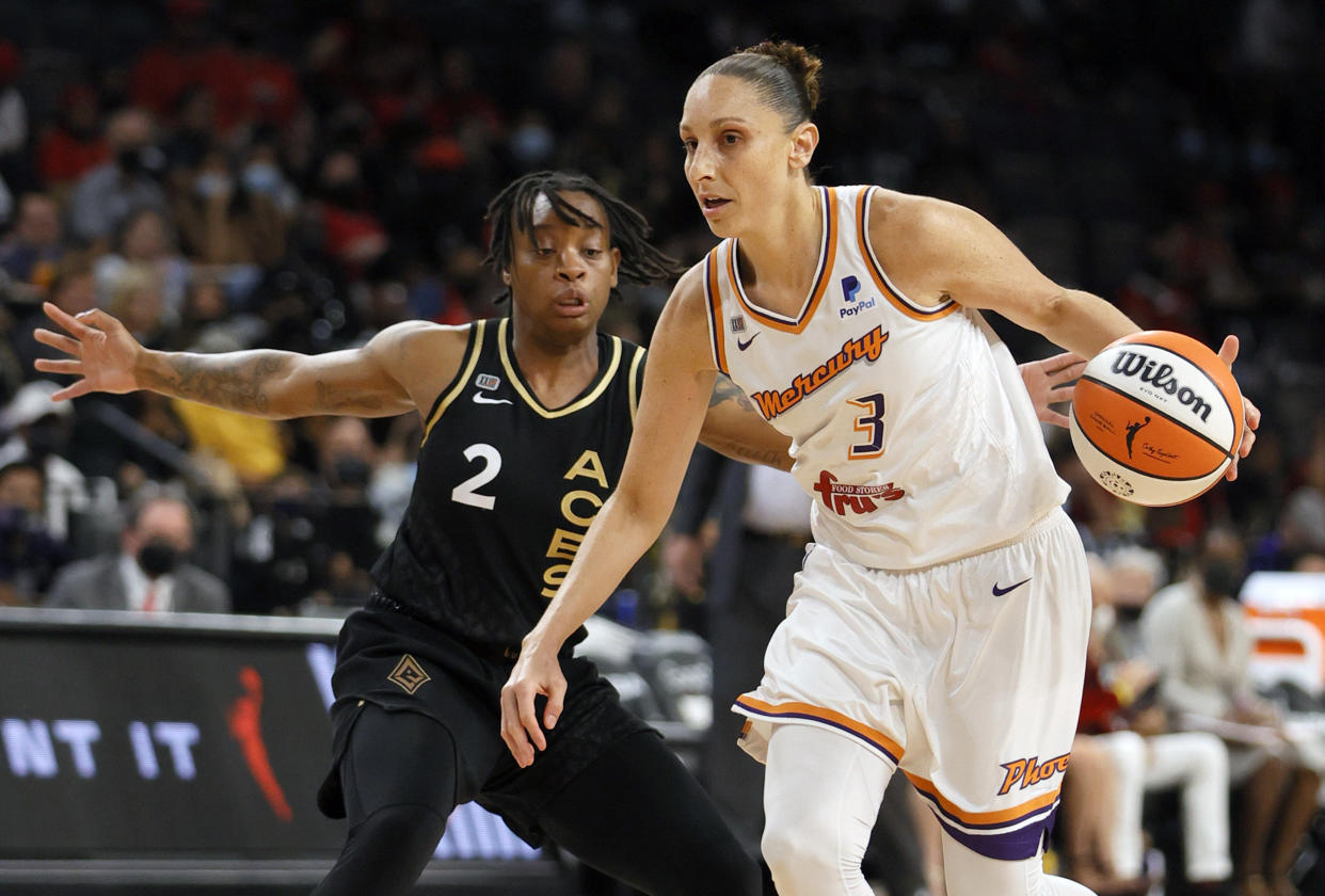 Mercury star Diana Taurasi drives against the Aces' Riquna Williams during Game 2 of the 2021 WNBA semifinals at Michelob ULTRA Arena in Las Vegas on Sept. 30, 2021. The Mercury defeated the Aces 117-91 behind Taurasi's playoff career-high 37 points. (Ethan Miller/Getty Images)