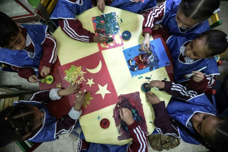 Pupils participate in a handicraft workshop at the Mahaba school on October 13, 2018