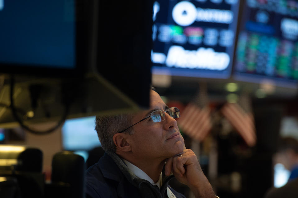 Traders work on the floor at the closing bell of the Dow Industrial Average at the New York Stock Exchange on September 12, 2018 in New York. - Wall Street stocks finished little changed on Wednesday following a volatile session amid lingering trade war anxiety, while Apple shares fell following its latest product launches. The Dow Jones Industrial Average inched up 0.1 percent to 25,998.92. The broad-based S&P 500 added a hair at 2,888.92, while the tech-rich Nasdaq Composite Index slipped 0.2 percent to 7,954.23. (Photo by Bryan R. Smith / AFP)        (Photo credit should read BRYAN R. SMITH/AFP via Getty Images)