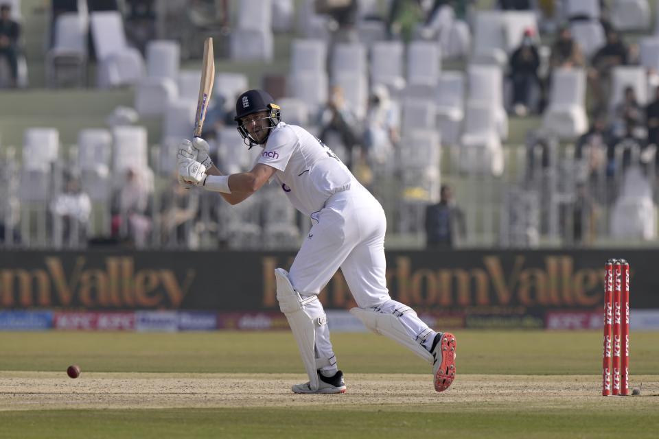 England's Ollie Robinson plays a shot during the second day of the first test cricket match between Pakistan and England, in Rawalpindi, Pakistan, Friday, Dec. 2, 2022. (AP Photo/Anjum Naveed)