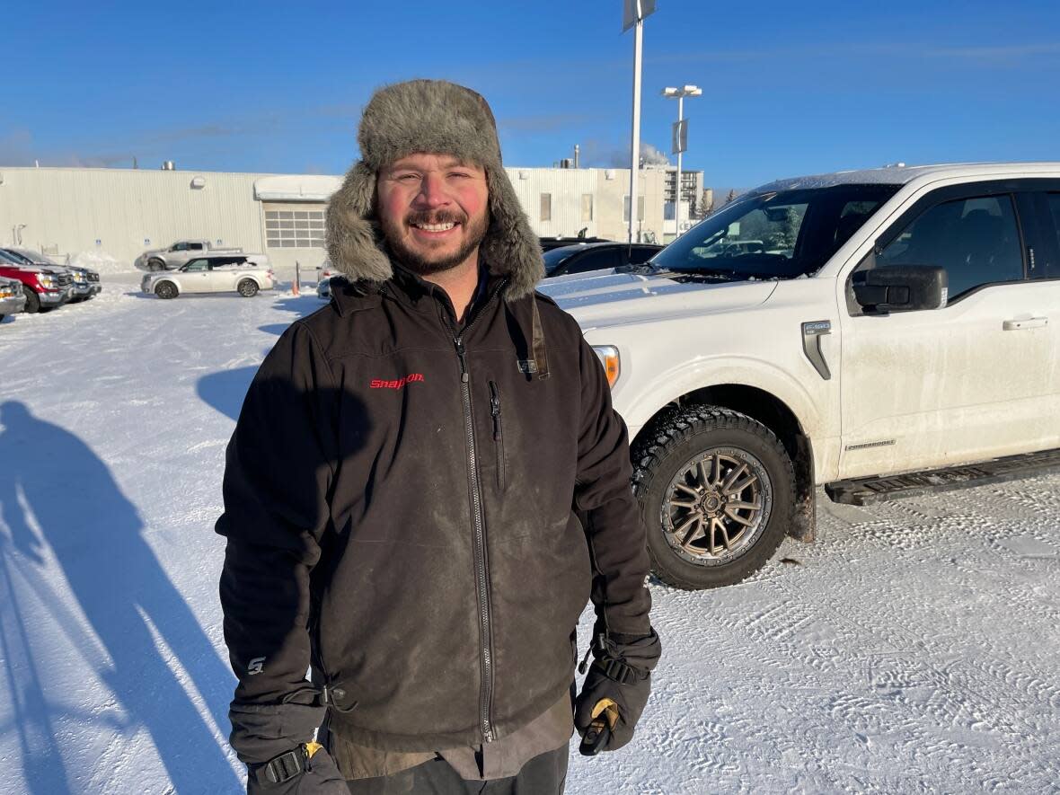 Colin Harris, a service technician at Kentwood Ford in Edmonton, says the cold weather this week has led to an increase in customers needing their vehicles fixed. (Travis McEwan/CBC - image credit)