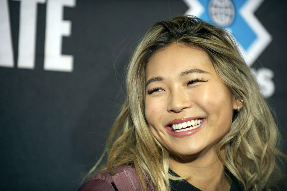 FILE - In this Wednesday, Jan. 23, 2019, file photo, snowboarder Chloe Kim smiles at an X Games press conference in Aspen, Colo. Heading to Princeton next fall, Kim is trading her board for books as she tries to blend in and become your normal college freshman. (Anna Stonehouse/The Aspen Times via AP, File)