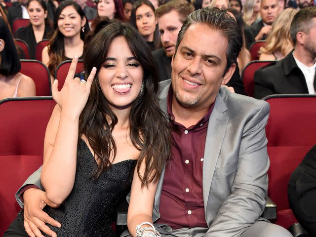 <p>Kevin Mazur/AMA2018/Getty </p> Camila Cabello and Alejandro Cabello at the 2018 American Music Awards.