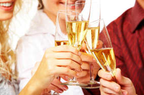 Photo of champagne glasses during toast at party