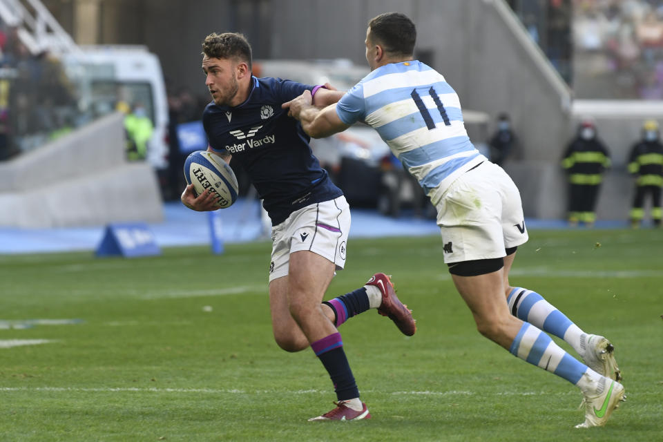 Scotland's Rory Hutchinson, left, is tackled by Argentina's Los Pumas Juan Imhoff, during a rugby test match in Santiago Del Estero, Argentina, Saturday, July 16, 2022. (AP Photo/Gustavo Garello)