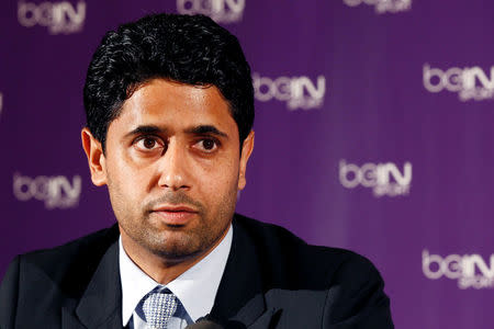 FILE PHOTO: Nasser Al-Khelaifi (L), Paris St Germain's club owner and owner of Qatari TV channel Al Jazeera Sport, President of beIN Sport French TV channel, attends a news conference in Paris May 24, 2012. Picture taken May 24, 2012. REUTERS/Jacky Naegelen