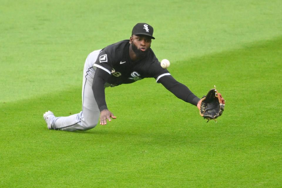 Chicago White Sox center fielder Luis Robert Jr. (88) makes a diving catch against the Cleveland Guardians on Wednesday in Cleveland.