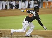 <p>Miami Marlins’ Adeiny Hechavarria watches after hitting a single to score Justin Bour during the third inning of a baseball game against the New York Mets, Monday, Sept. 26, 2016, in Miami. (AP Photo/Lynne Sladky) </p>