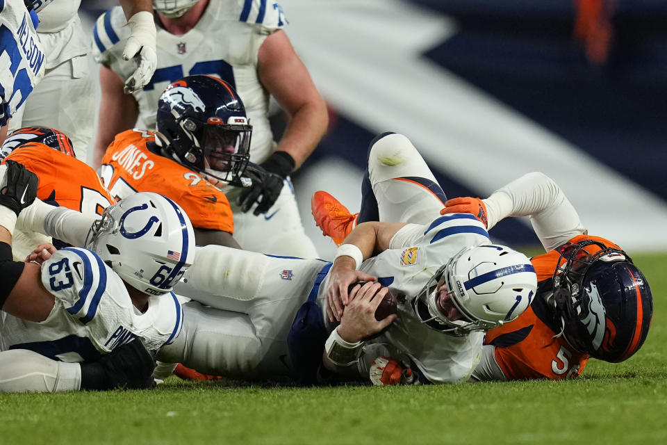 Indianapolis Colts quarterback Matt Ryan is sacked by Denver Broncos linebacker Baron Browning, right, during the second half of an NFL football game, Thursday, Oct. 6, 2022, in Denver. (AP Photo/Jack Dempsey)