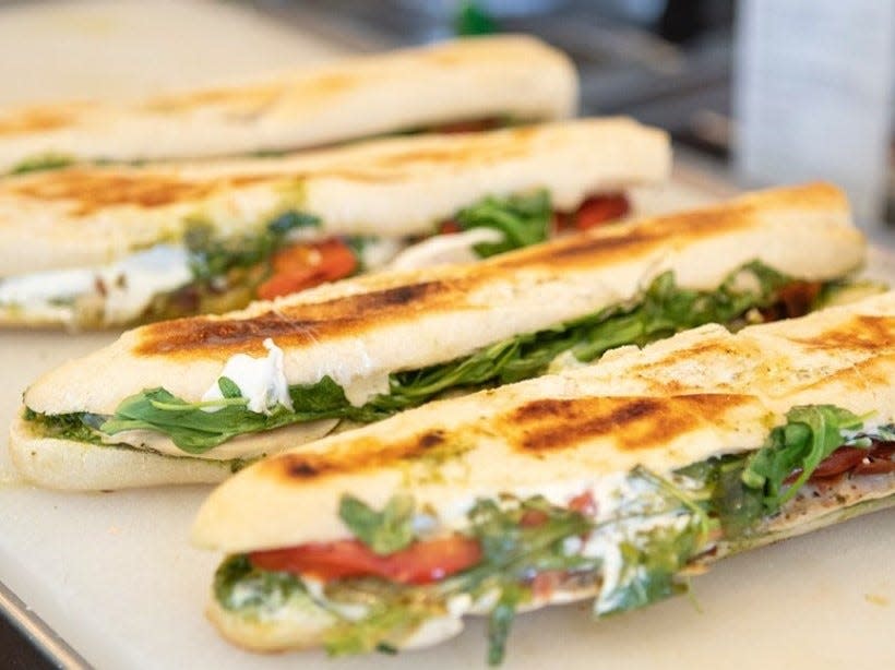 On the menu at Field of Greens restaurants: the popular Chicken Pesto Panini.