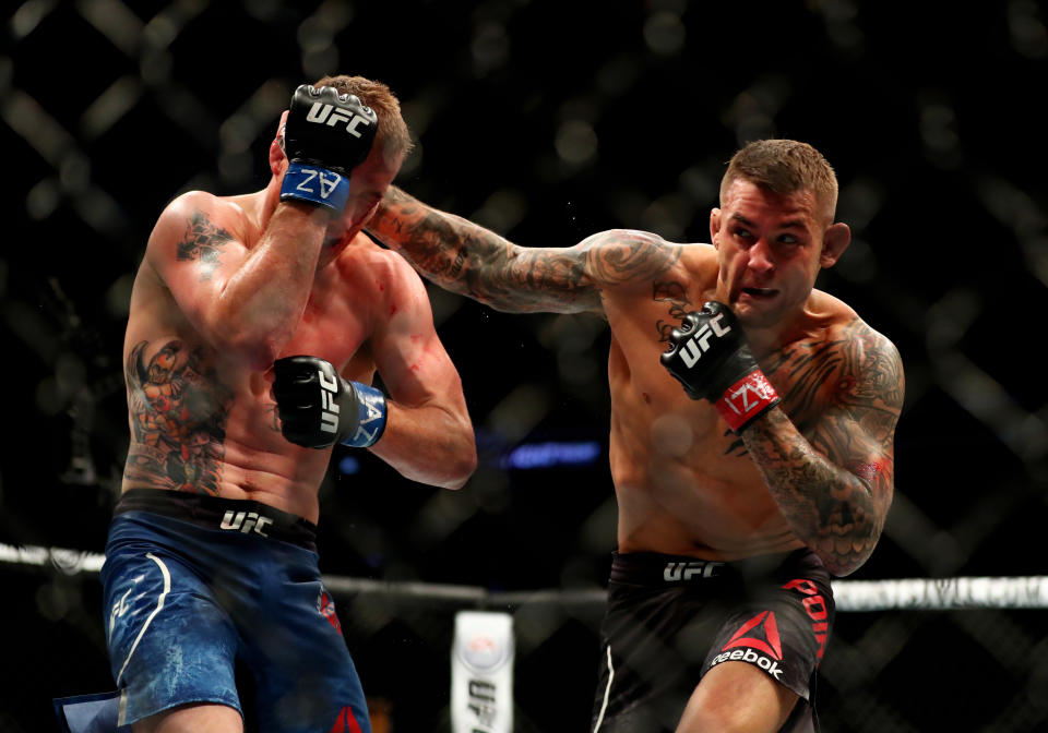 Apr 14, 2018; Glendale, AZ, USA; Dustin Poirier (red gloves) fights against Justin Gaethje (blue gloves) during UFC Fight Night at Gila River Arena. Mandatory Credit: Mark J. Rebilas-USA TODAY Sports