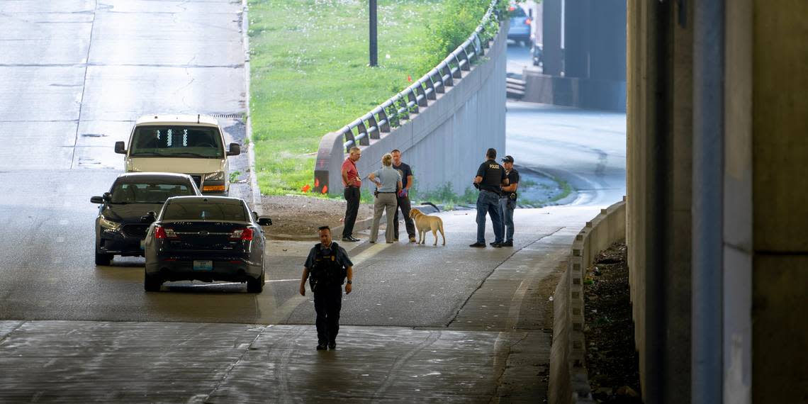 Police work the scene of a fatal shooting on westbound lanes of Interstate 670 near Broadway Boulevard June 7 in Kansas City.