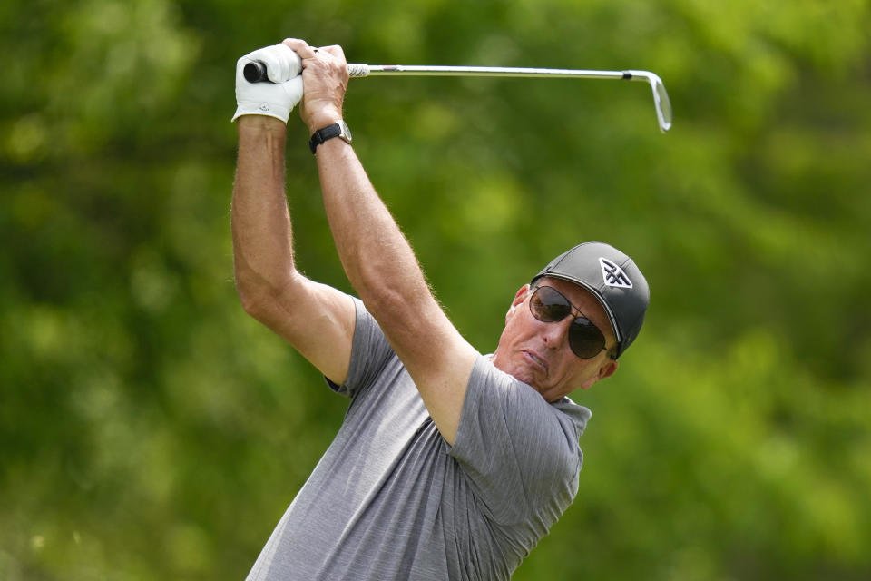 Phil Mickelson watches his tee shot on the third hole during the second round of the PGA Championship golf tournament at Oak Hill Country Club on Friday, May 19, 2023, in Pittsford, N.Y. (AP Photo/Seth Wenig)