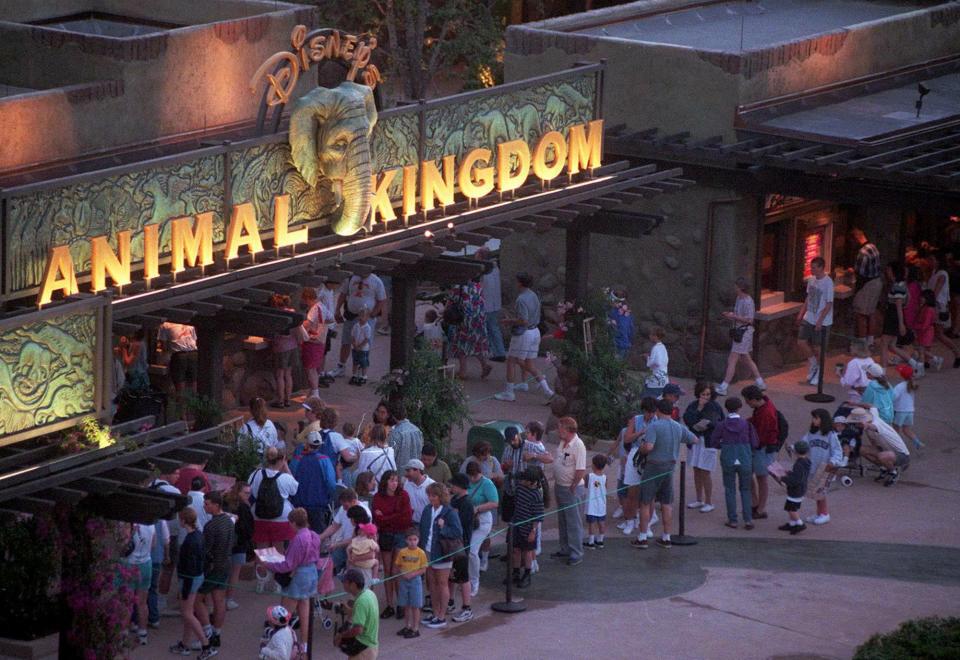 People wait to buy Animal Kingdom passes at Disney World in April 1998.